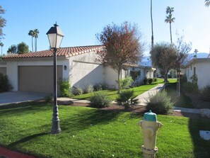 Street side facade with entrance to two car garage.