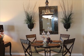 Dining area with mosaic glass mirror. Very elegant looks!