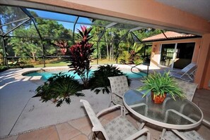 Swimming pool and lanai with live tropical plants. Privacy and serenity.