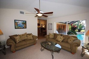 More secluded family room, looking toward breakfast nook and living room.