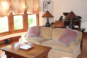Living room with baby grand piano