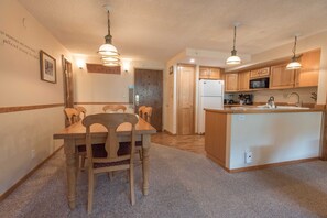 view of dining area and kitchen from living room