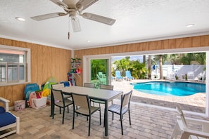 Lanai Dining  in Enclosed Porch Overlooking Pool