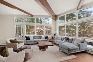Sun-filled living room with HD television, Sonos sound system, fireplace & a/c