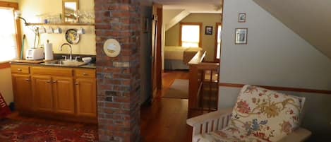 3rd floor 
view of kitchenette/queen bed down the hall 