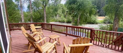 Deck with Adirondack Chairs Overlooking River