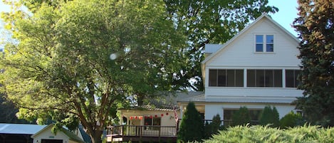 Built in 1908 here's a summer view -surrounded by Ash, Black Walnut & evergreens