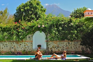 A view of the 11 mtr. Lap pool from the dinning room.the Agua Volcano in backgrd