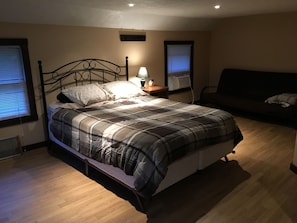 upstairs bedroom with queen bed and futon