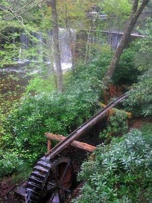 The Original Working Water Wheel in Summer. View out of Master Bedroom window.