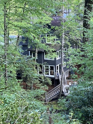 The Mll House and river deck viewed from across Cullusaja River