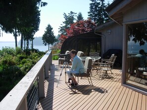 Guest viewing seals off our beach with our spotting scope from the large deck
