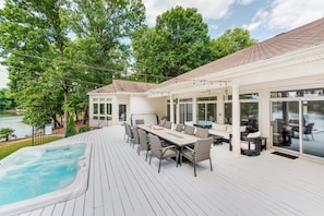Enjoy al fresco dining on the deck with two fire tables and a great lake view.