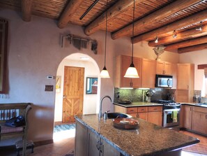 Fully Equipped Cook's Kitchen and Island with room for extra seating.