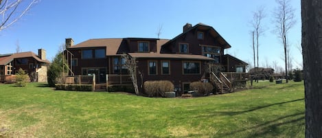 Spring time view of the Clubhome unit from the back yard (9th fairway).