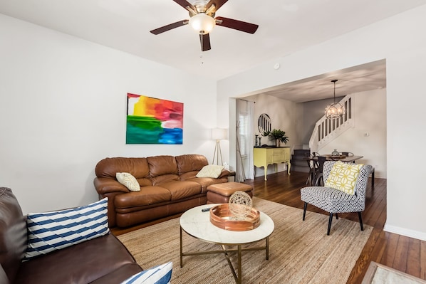 Plenty of living room seating with an adjoining dining table.