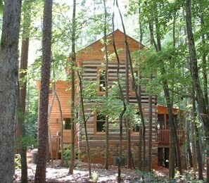 side view of cabin with gentle slope to water's edge