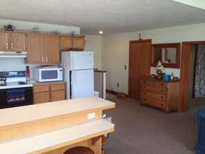 kitchen.  Master bedroom and bathroom are around the corner.  Stairs to basement