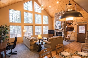 Main living area with fireplace and desk (left) with available printer.