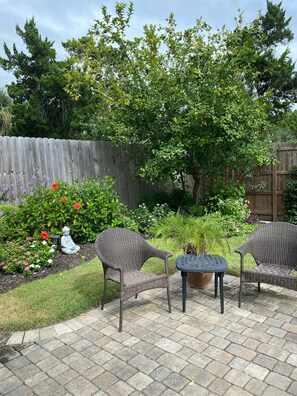 Small seating area on paved patio.