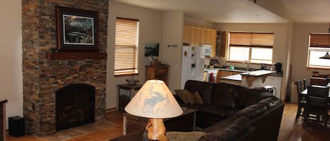 Living Room with remote controlled fireplace and flat screen TV