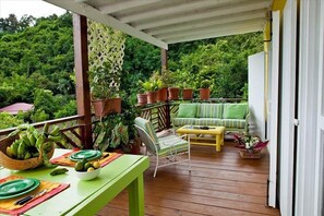 Roofed deck breakfast unforgettable. Trade Wind breezes eliminates A/C & bugs