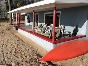 Enjoy relaxing on the wide covered porch while watching the freighters go by.