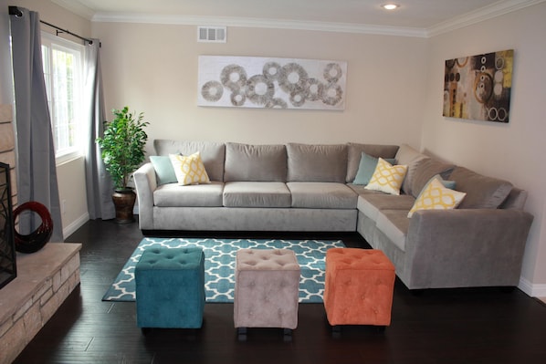 Open space living room with 60' flat screen tv