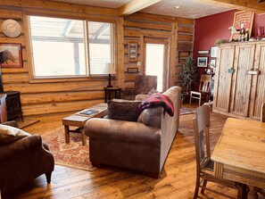 Living area off of the kitchen. Queen sofa sleeper.