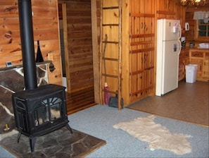 A view of the hearth stove and entrance to hallway.