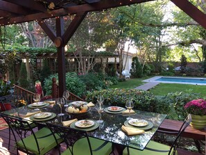 Back porch looking at gardens and pool