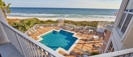 View of pool deck and beach from the balcony