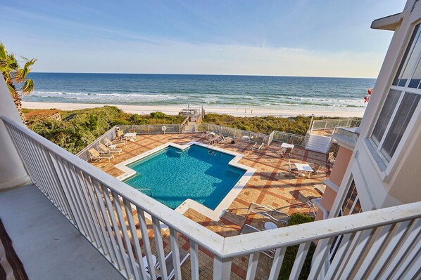 View of pool deck and beach from the balcony