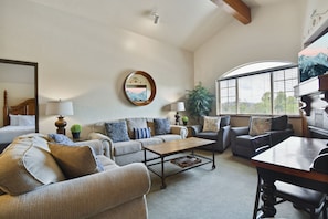 Living room with vaulted ceiling