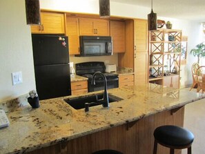 Remodeled kitchen with new appliances and granite counter tops