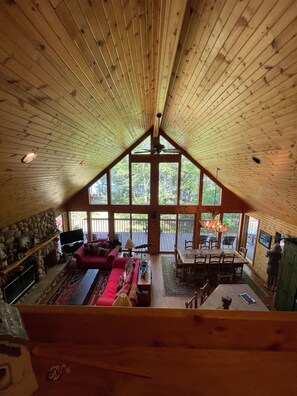 Main floor wood fireplace, tv and seating, dining and kitchen with large island