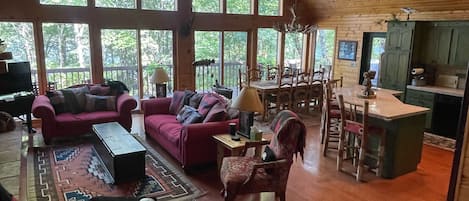 Main floor overlooking lake with seating on large deck