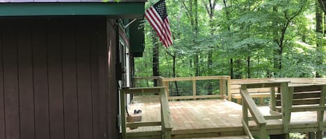 expansive deck serves as the entry point for the cabin