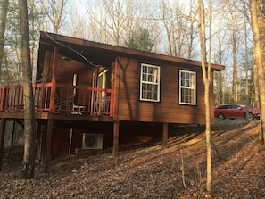 the setting sun shines on the back deck.  A very private place to enjoy .