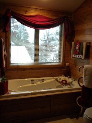 master bathroom jetted tub, shower, and large vanity