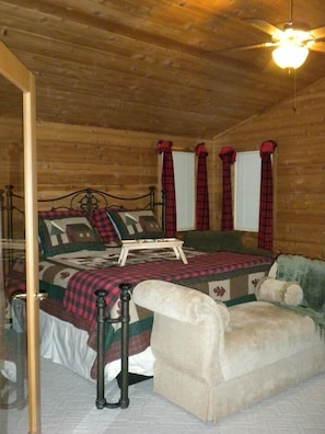 Master bedroom with sitting area, private bath, and with view of lake