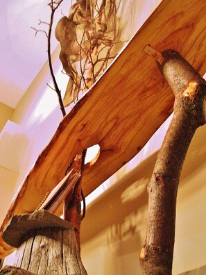 CONDO #1: Underside of console table shows the ancient root stump and maple slab