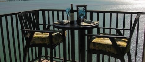 Boca Ciega Bay sparkles as you enjoy a refreshing drink at our  new bistro set