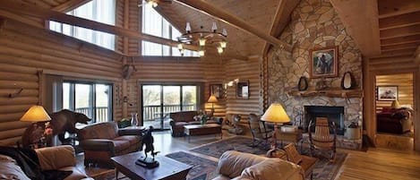 Expansive Living Room with stone fireplace
