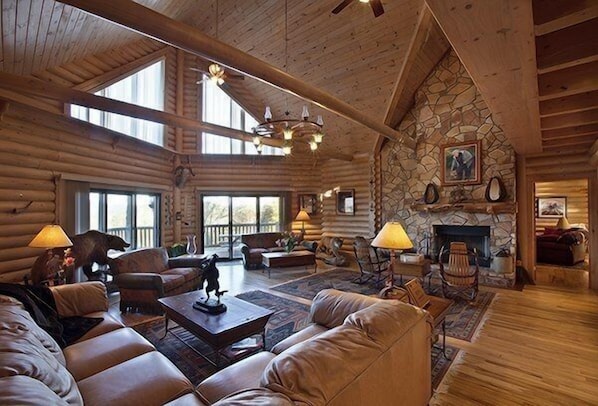 Expansive Living Room with stone fireplace
