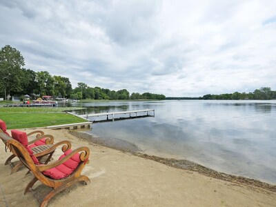 Sandy beach area and a dock to moor your boat.