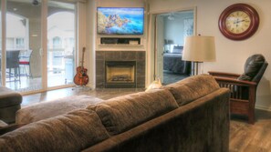 Master bedroom directly off the living room.  New, 55" TV, surround sound system