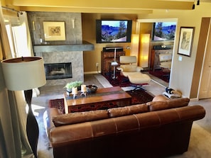 Relax next to the fire, TV and views of the mountains.