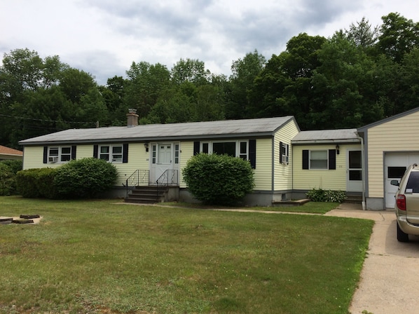 Street side view of the house in summer.