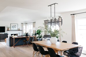 Open floorplan living and dining room on the second floor with 2 balconies